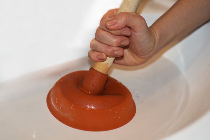 Plunger Removing Clogged Sink